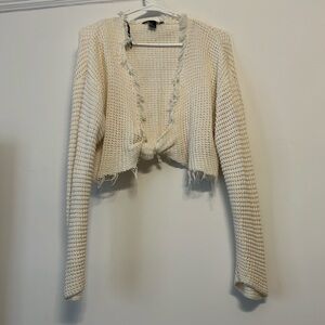 White cropped throw over top
